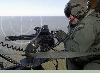 United States Sailor firing a GAU-17. GAU-17s stored Combat Weapons Rack meet OPNAVINST 5530.13 & AR190-11 physical security requirements for stowage of arms.