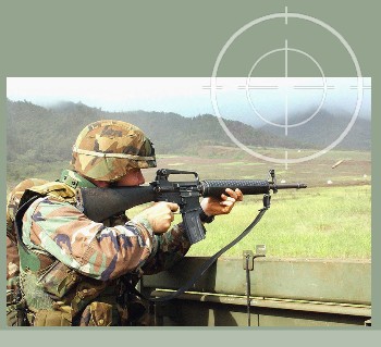 United States Army firing an M16A2 in a training excercise. M16A2 stored in a Combat Weapons Rack meet Army AR190-11 small arms storage requirements.