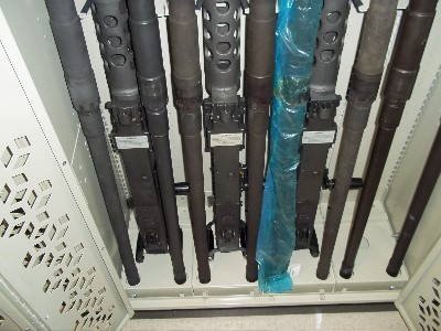 .50 cals stored with spare barrels in mobile weapon rack system