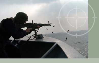 United States Army Soldier firing M60 machine gun during training excercises for Operation Iraqi Freedom. M-60 machine guns can be stored in Combat Weapons Storage Racks with the bi-pod attached to the weapon.