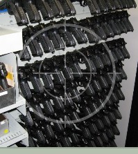 M9s stored on pistol pegs in Combat Weapon Shelving Systems