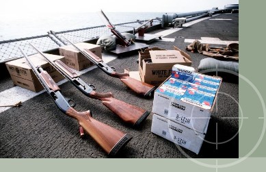 870 Shotgun Weapon System including 12 gauge Remington M870s stored in Combat Weapon Racks